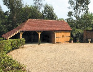 This traditional three-bay (frame C-4) incorporates a full-length logstore giving additional covered space.