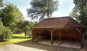 A SuperSize oak frame with an oak roof. Felt was not used in the roof, allowing the beauty of the hand-made clay tiles to be visible from the inside of the building.
