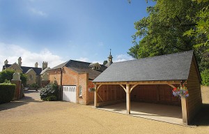 This two-bay cart barn with a natural slate roof sits pretty in a rural setting in Romsey, Hampshire.